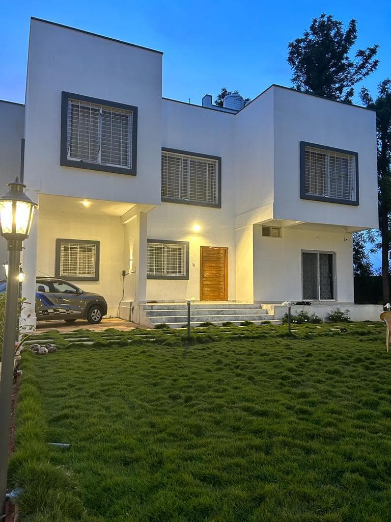 Farmhouse front view at dusk