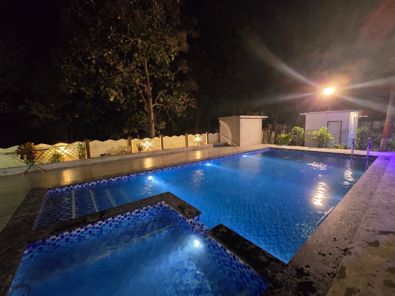 Pool at night with underwater lights